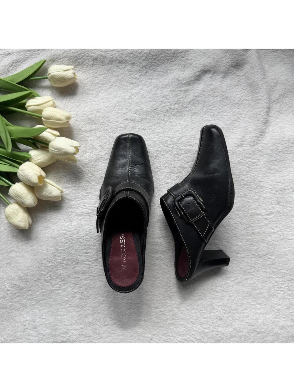 All Rocco's black leather mules with buckle detail